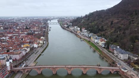 Karl-Theodor-Bridge-Over-Neckar-River-in-Heidelberg-Germany,-Static-Aerial