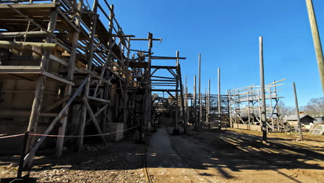 Ruins-of-an-old-wooden-multi-storey-building,-destruction-during-war-in-Ukraine