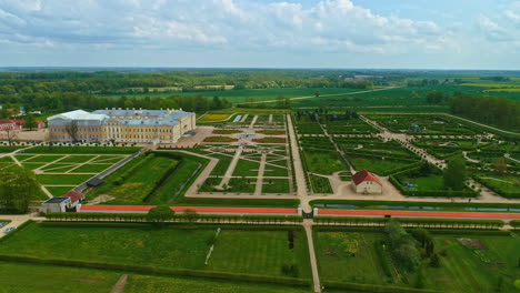 Rundale-palace-and-the-park-with-garden-in-front,-aerial-panoramic-view