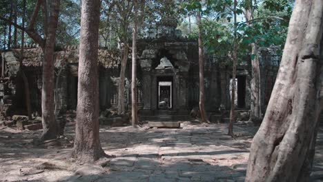 Ancient-temple-ruins-of-Angkor-Wat-surrounded-by-a-forest-in-daylight