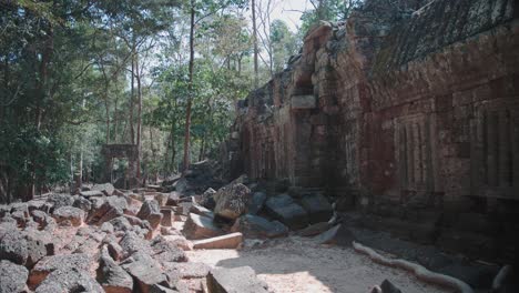 Ancient-Angkor-Wat-temple-ruins-among-lush-forests-in-Cambodia,-tranquil-and-historical