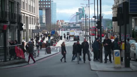 People-crossing-the-road-with-London-Bridge-in-the-background