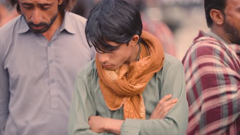 Closeup-shot-of-Pakistani-men-standing-in-Iftar-Drive-for-food-Distribution-to-Poor-People-of-Balochistan,-Pakistan