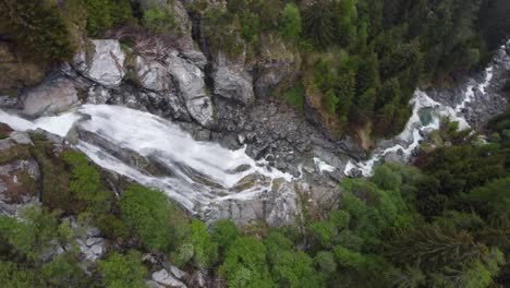 Aerial-View-Of-Waterfall-Cascading-Down-Mountain-In-Gressoney,-Aosta-Valley,-Italy---Drone-Shot