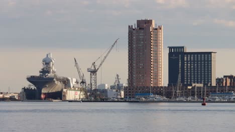 The-ferry-terminal-and-shipyard-on-the-confluence-of-Elizabeth-River-overlooking-General-Dynamics-NASSCO-Norfolk-shipyards-in-the-Port-of-Hampton-Roads,-Norfolk,-Virginia