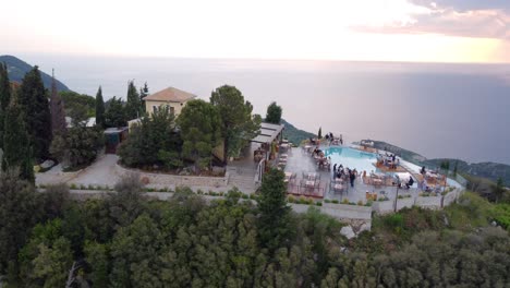 Overlooking-the-sea,-a-prestigious-restaurant-stands-proudly-on-a-hill-in-Lefkada,-Greece