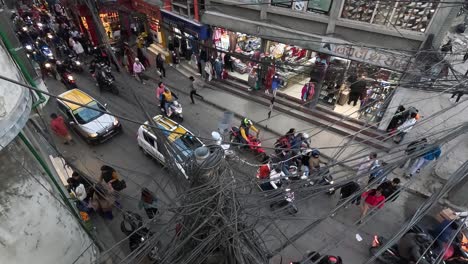 Overhead-View-of-Chabahil-Intersection:-Electric-Cables-Framing-the-Bustling-Traffic-Below-on-Kathmandu’s-Ring-Road