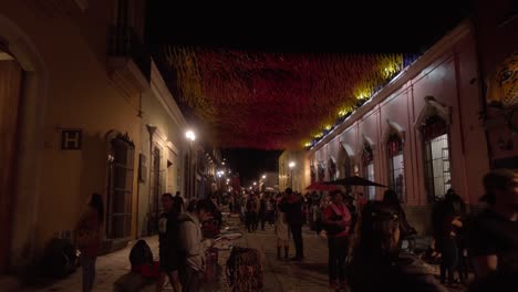 Tourist-street-adorned-with-theme-of-Día-de-Muertos-festivities-in-Oaxaca-city