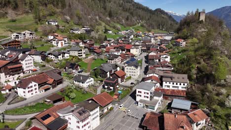 Aerial-birds-eye-shot-of-swiss-small-village-on-top-of-mountain-at-sunny-day