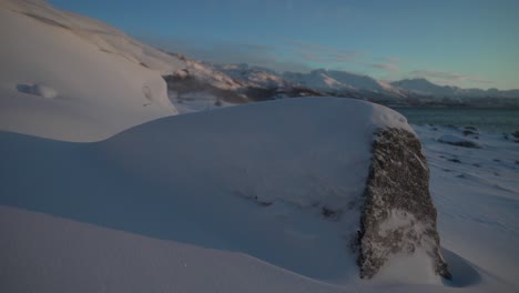 Snow-covered-rock-in-Lofoten,-Norway