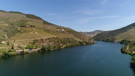 Train-traveling-on-the-banks-of-the-famous-douro-river-Portugal