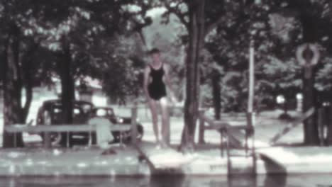 Man-Takes-Off-Bathrobe-and-Stays-in-Bathing-Suit-in-Swimming-Pool-Vintage-Video