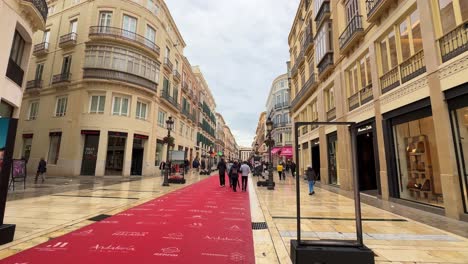 Red-carpet-on-main-promenade-walking-street-in-Malaga-south-Spain-day-time