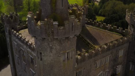 Aerial-tilt-of-Charleville-Castle-featuring-its-details,-ending-on-its-tower