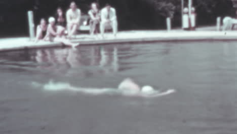 Woman-in-Swimsuit-Dives-into-Pool-on-Sunny-Summer-Day-of-1930s