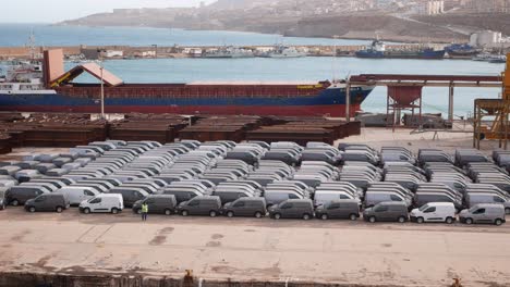 Lines-of-new-Fiat-vans-in-the-Mostaganem-pier,-Algeria