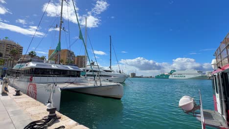 Catamaran-ship-docked-moored-at-Malaga-marina-port-in-Spain-Costa-del-Sol