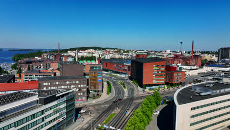 Aerial-tracking-shot-of-the-Ratina-cityscape,-sunny-summer-day-in-Tampere,-Finland