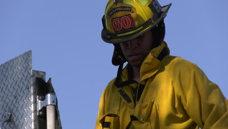 LAFD-Firefighter-packing-up-engine