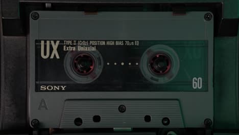Placing-and-Playing-Audio-Cassette-Tape-in-Vintage-Deck-Player-From-1980's-Close-Up