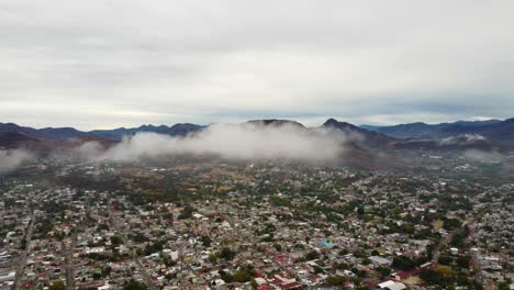 Drone-video-of-the-clouds-and-the-Yucunitza-Hill-in-Huajuapan-de-Leon,-Oaxaca,-Mexico