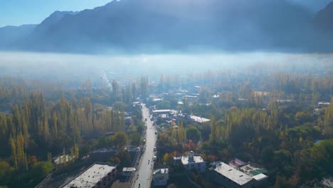 Aerial-View-Of-Morning-Mist-Floating-Above-Valley-Floor-In-Skardu-Valley-In-Gilgit-Baltistan