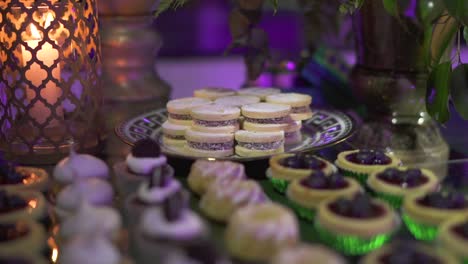 Event-table-with-a-variety-of-desserts,-including-cupcakes-and-cookies