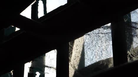 Alcatraz-Prison-USA-Detail,-Cobweb-Between-Metal-Bars-on-Window,-Close-Up