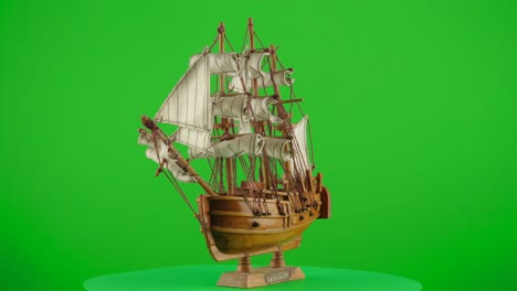 Scale-wooden-model-ship-Endeavor-Royal-Navy-research-vessel-that-Lieutenant-James-Cook-in-a-turntable-with-green-screen-for-background-removal
