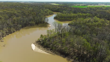 River-Flowing-Through-Forest-In-Lower-Hatchie-National-Wildlife-Refuge,-Tennessee,-USA---Aerial-Drone-Shot