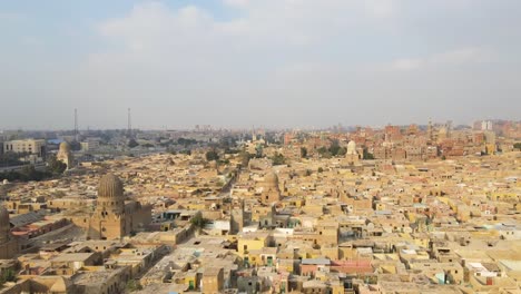 Aerial-of-the-residential-district-of-Old-Town-Cairo-in-Egypt-unfolds,-showcasing-traditional-houses-and-architectural-heritage,-the-concept-of-cultural-preservation,-and-historical-continuity