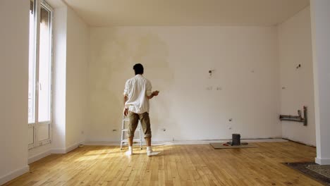 Chalky-Limewashed-Paint-In-The-Wall-Of-An-Empty-Room