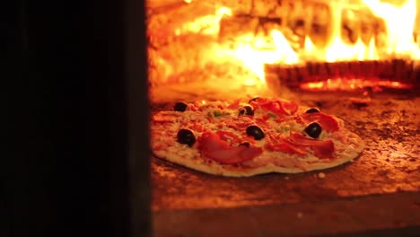 Wood-is-burning-in-a-pizza-oven