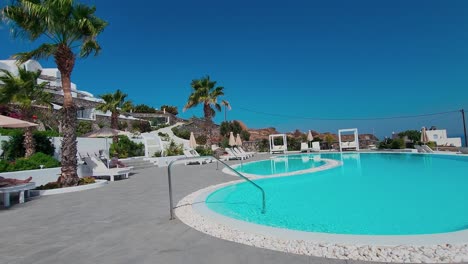 Sunny-day-by-the-hotel-pool-with-palm-trees