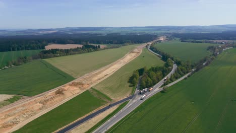 Aerial-view-of-highway-under-construction-with-moving-traffic