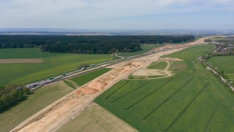 Aerial-view-of-construction-equipment-building-an-automobile-highway
