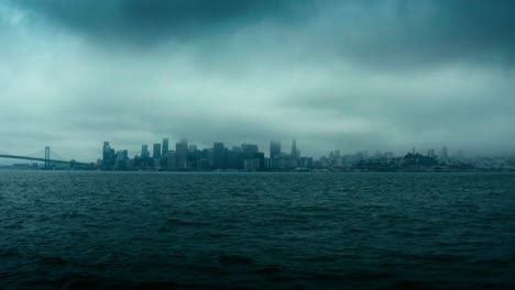 Incredibly-dark,-ominous,-and-dramatic-aerial-shot-of-the-New-York-City-skyline-in-low-clouds-and-heavy-fog