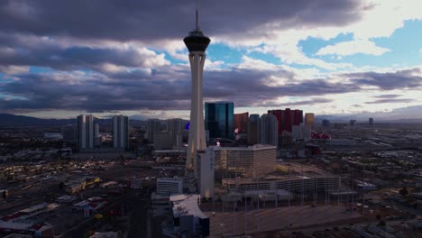 Las-Vegas-NV-USA-at-Sunset,-Aerial-View-of-The-Strat-Tower-and-North-Strip-Buildings,-Drone-Shot