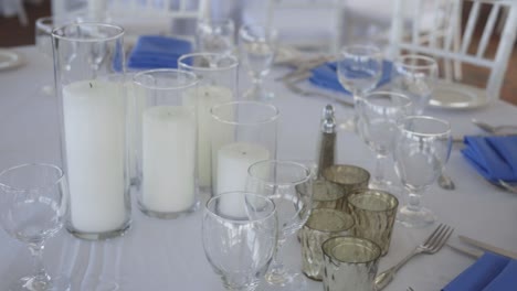 Worker-prepares-table-at-wedding-reception