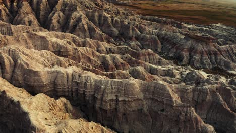Beautiful-panning-aerial-drone-shot-of-a-desert-canyon-terrain-landscape