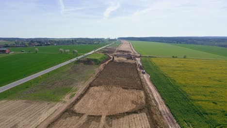 Aerial-view-showcasing-the-expansive-progress-of-a-major-road-or-highway-under-construction