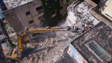 Aerial-View-Of-Demolishing-Destruction-Tractor-Crane-At-Tel-Aviv-In-Israel
