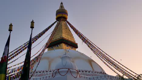 Wide-view-of-the-central-Stupa-in-Boudhanath-Temple-at-sunset,-Kathmandu,-Nepal
