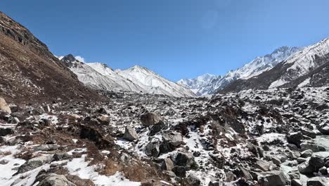 High-Alpine-Trek-in-Langtang-Valley,-Nepal:-Journey-through-icy-landscapes-with-Tserko-Ri-and-Gangchempo-peaks-in-the-backdrop