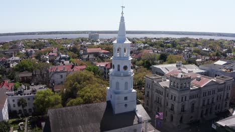 Aerial-rising-close-up-shot-of-the-spire-atop-Saint-Michael's-Church-in-Charleston,-South-Carolina