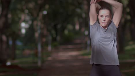 Active-Lifestyle,-Woman-Doing-Post-Run-Stretch-in-Nature,-Medium-Slow-Motion-Shot