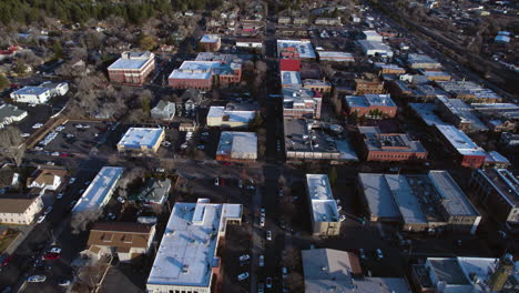 Aerial-View-of-Flagstaff,-Arizona-USA,-Downtown-Buildings-and-Street-Traffic,-Revealing-Drone-Shot