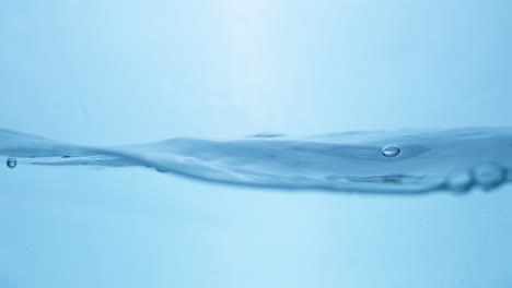 Water-waves-on-surface-with-blue-background