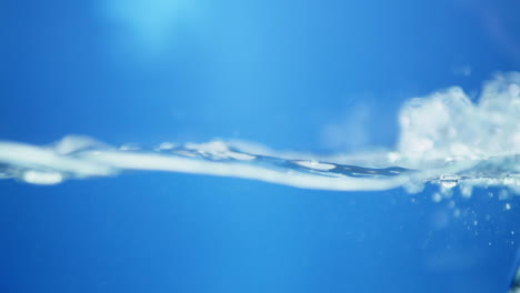 Water-waves-on-surface-with-blue-background_slow-motion