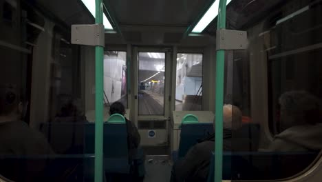 Glimpse-the-interior-of-the-subway-during-the-ride-to-the-DLR-underground-near-Greenwich,-London,-illustrating-the-concept-of-urban-commuting-and-efficient-public-transportation